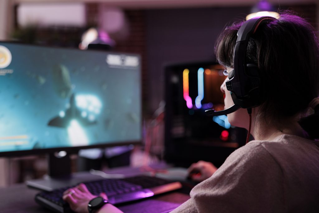 Young woman playing video games.